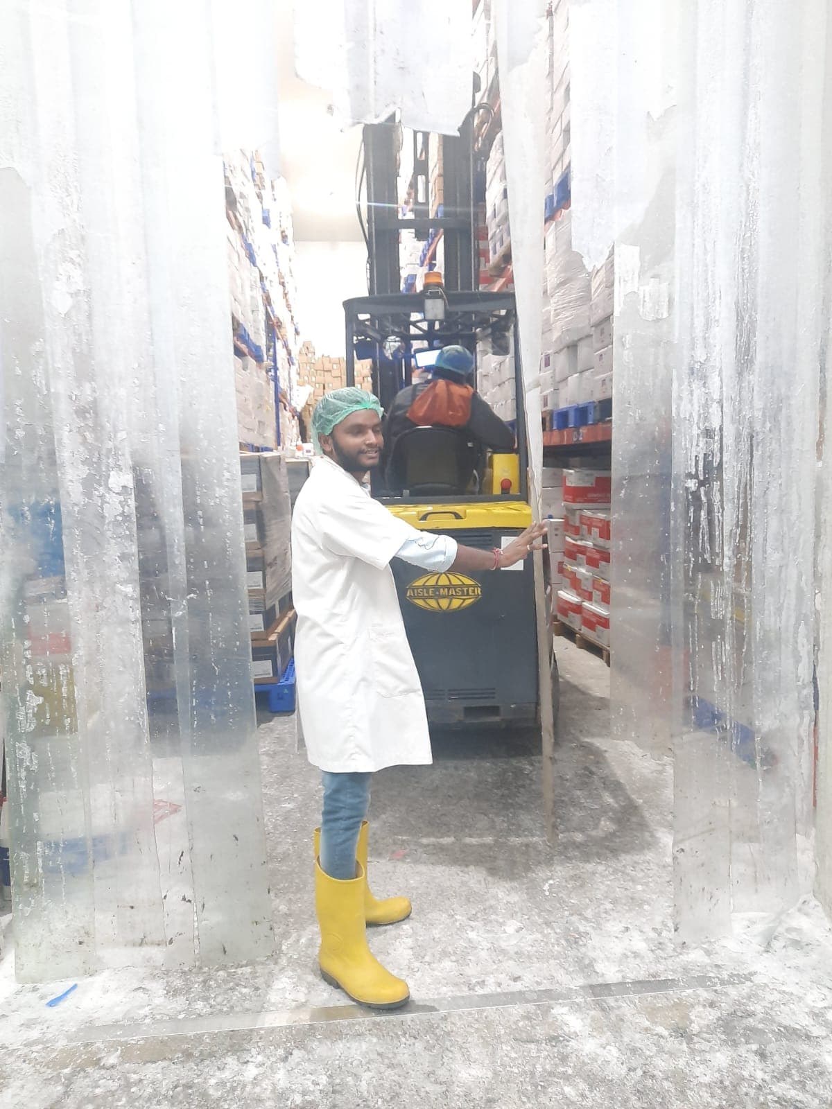 Cold storage aisle operations with pallet movement and lot handling in frozen inventory zones